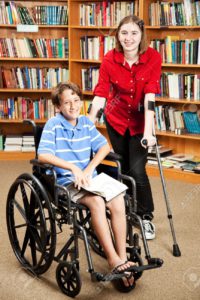10104143-Disabled-girl-and-boy-in-the-school-library--Stock-Photo-disability-wheelchair-disabled
