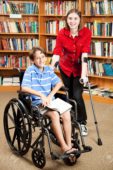 10104143-Disabled-girl-and-boy-in-the-school-library--Stock-Photo-disability-wheelchair-disabled